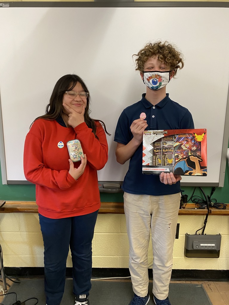 2 students pose with 1st & 2nd place prizes