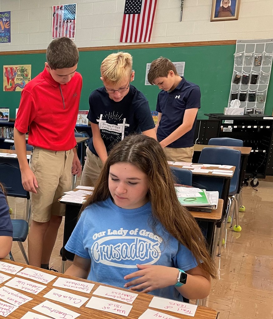 8th graders working on a social studies assignment.
