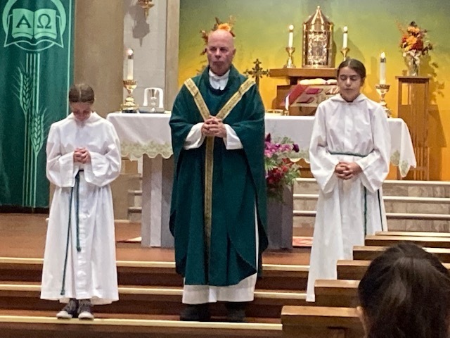 Father Pallardy and the altar servers