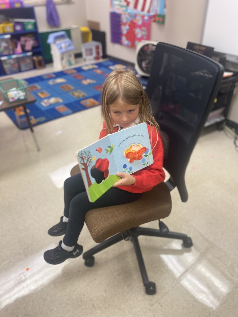 Student reading to her classmates.